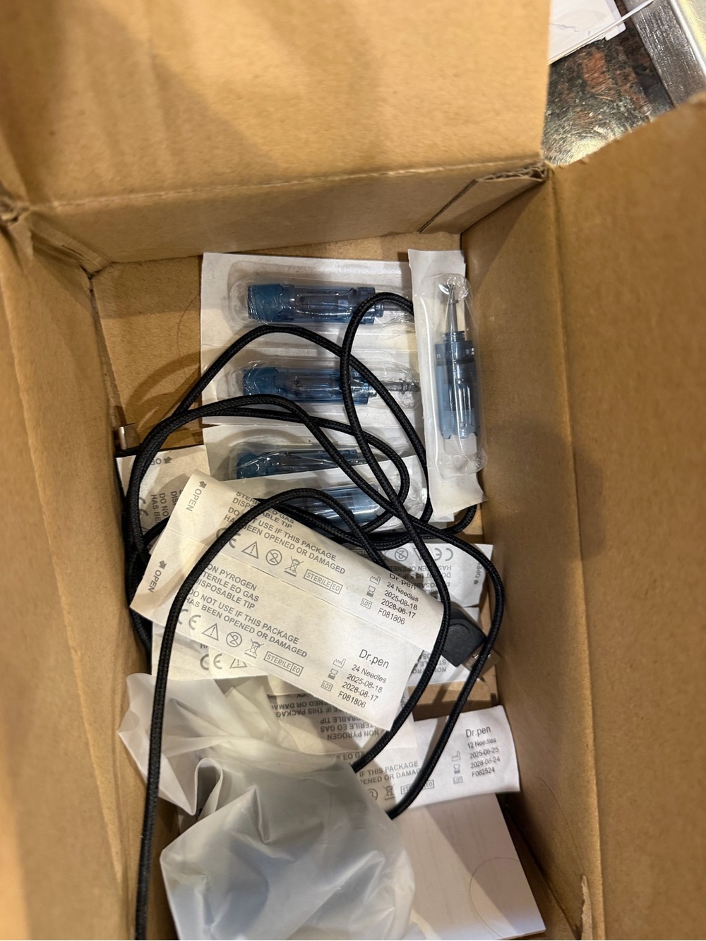 Black Corded Beauty Device with Blue Components